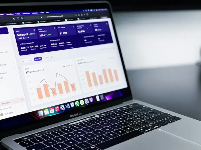 A laptop showing a cost and usage dashboard